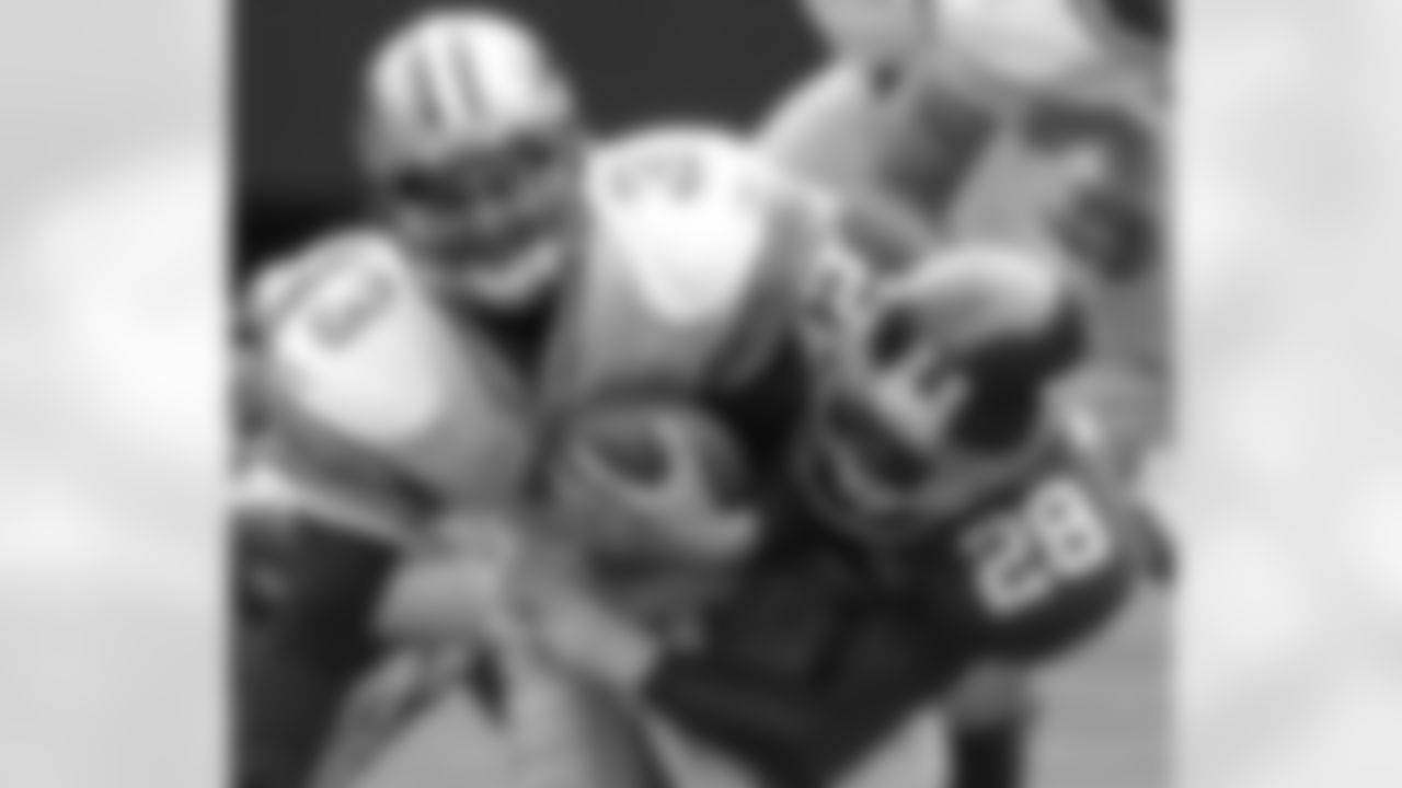 Detroit Lions quarterback Joey Harrington, left, is sacked by New York Giants safety Gabril Wilson during the second quarter Sunday, Oct. 24, 2004 at Giants Stadium in East Rutherford. (AP Photo/Bill Kostroun)