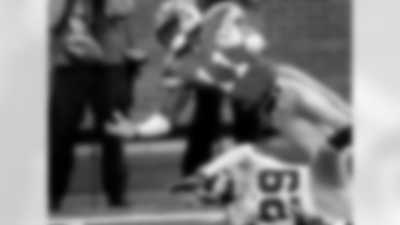 Detroit Lions receiver Roy Williams (11) reaches for the ball after New York Giants cornerback Sam Madison (29) deflected the pass intended for Williams during the first quarter of their NFL football game at Ford Field in Detroit, Sunday, Nov. 18, 2007. The pass was ruled incomplete. (AP Photo/Paul Sancya)