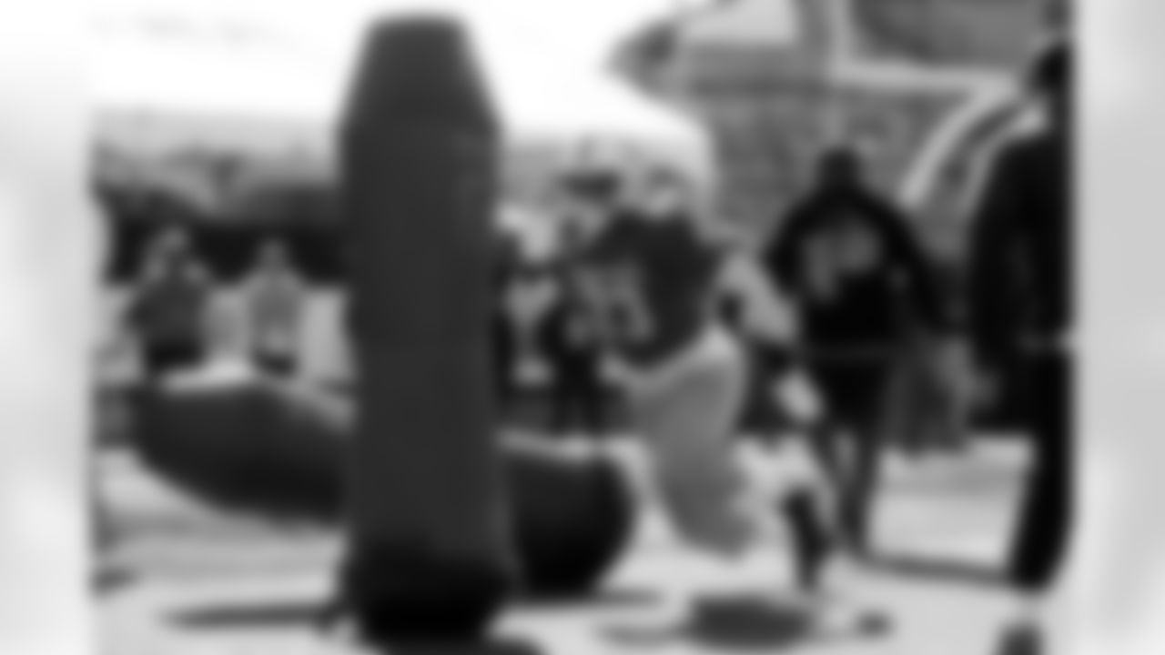 National Team defensive end Dani Dennis-Sutton (33), of Penn State, runs through drills during practice for the Senior Bowl NCAA college football game Tuesday, Jan. 27, 2026, in Mobile, Ala. (AP Photo/Butch Dill)