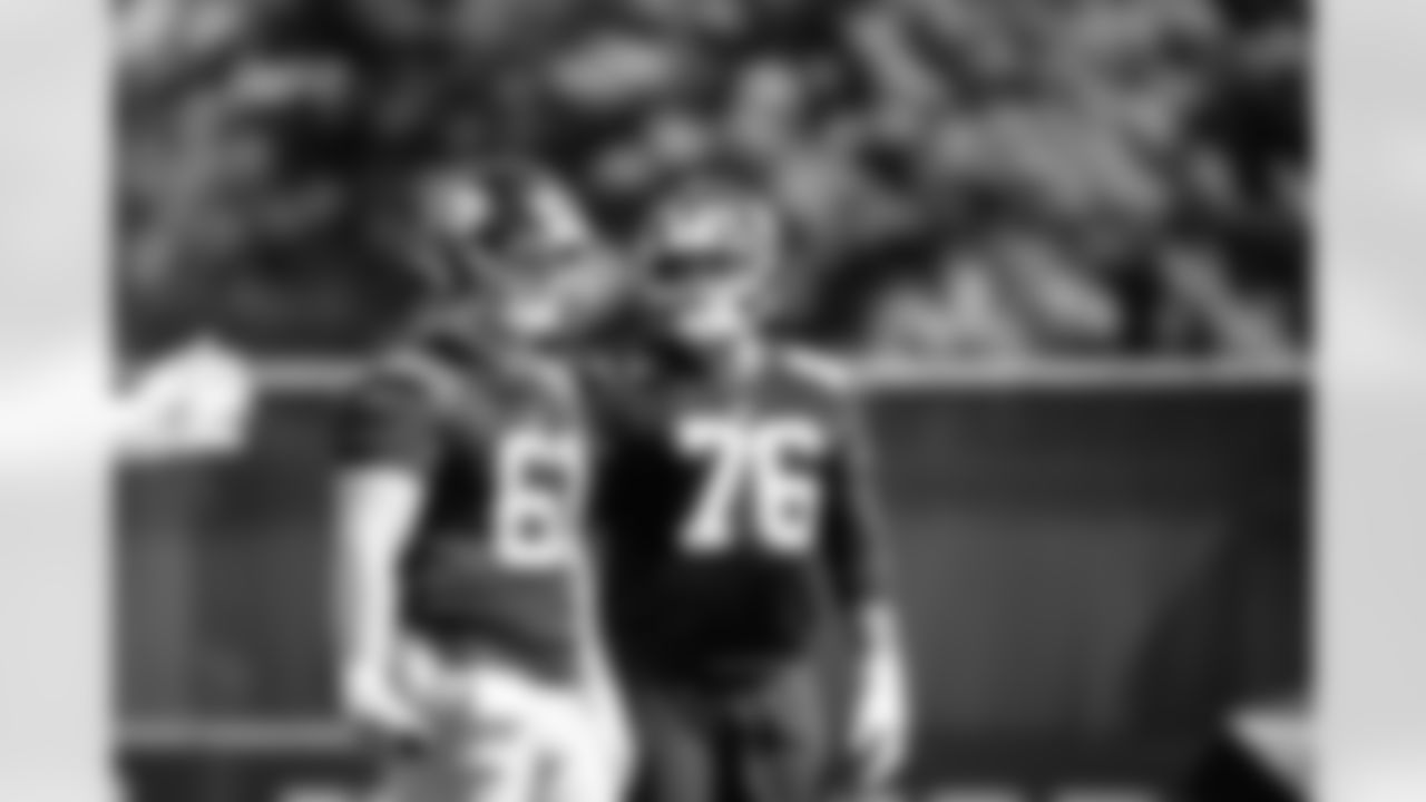 C John Michael Schmitz Jr. (61) and G Jon Runyan Jr. (76)