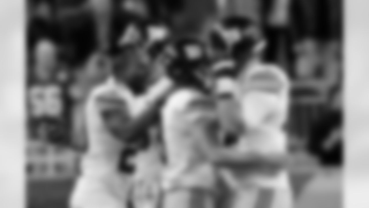 New York Giants kicker Josh Brown, center, is congratulated by teammates after his 45-yard field goal during the overtime period of an NFL football game against the Detroit Lions in Detroit, Sunday, Dec. 22, 2013. The Giants defeated the Lions 23-20. (AP Photo/Paul Sancya)