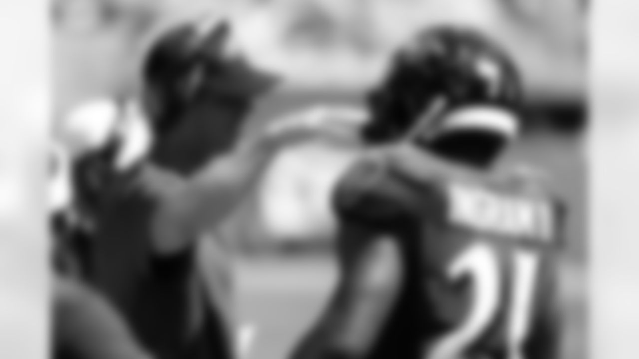 Baltimore Ravens head coach John Harbaugh talks to Baltimore Ravens running back Mark Ingram (21), during the second half at an NFL football game against the Miami Dolphins, Sunday, Sept. 8, 2019, in Miami Gardens, Fla. (AP Photo/Wilfredo Lee)