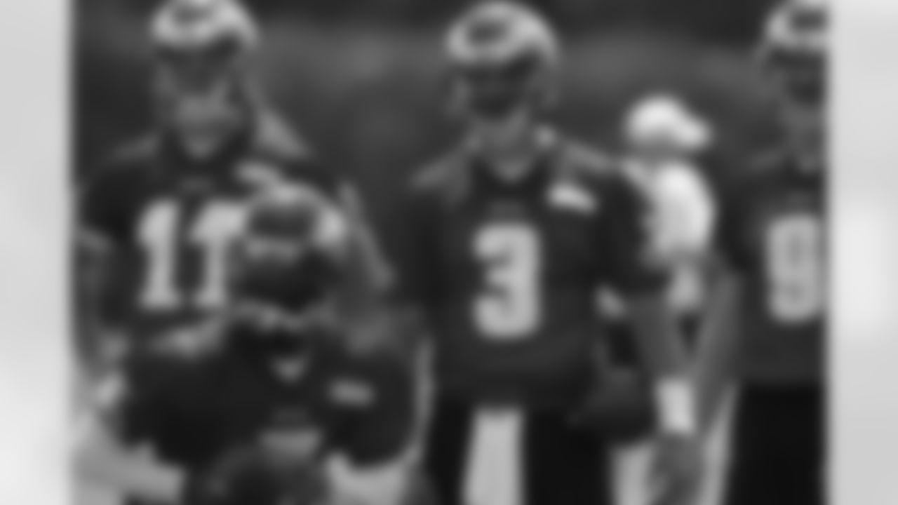 Philadelphia Eagles quarterbacks Trent Edwards back row left, Mike Kafka, and Nick Foles, watch as Michael Vick, front center, prepares to run a drill during an NFL football practice at their training facility Wednesday, May 23, 2012 in Philadelphia. (AP Photo/Alex Brandon)