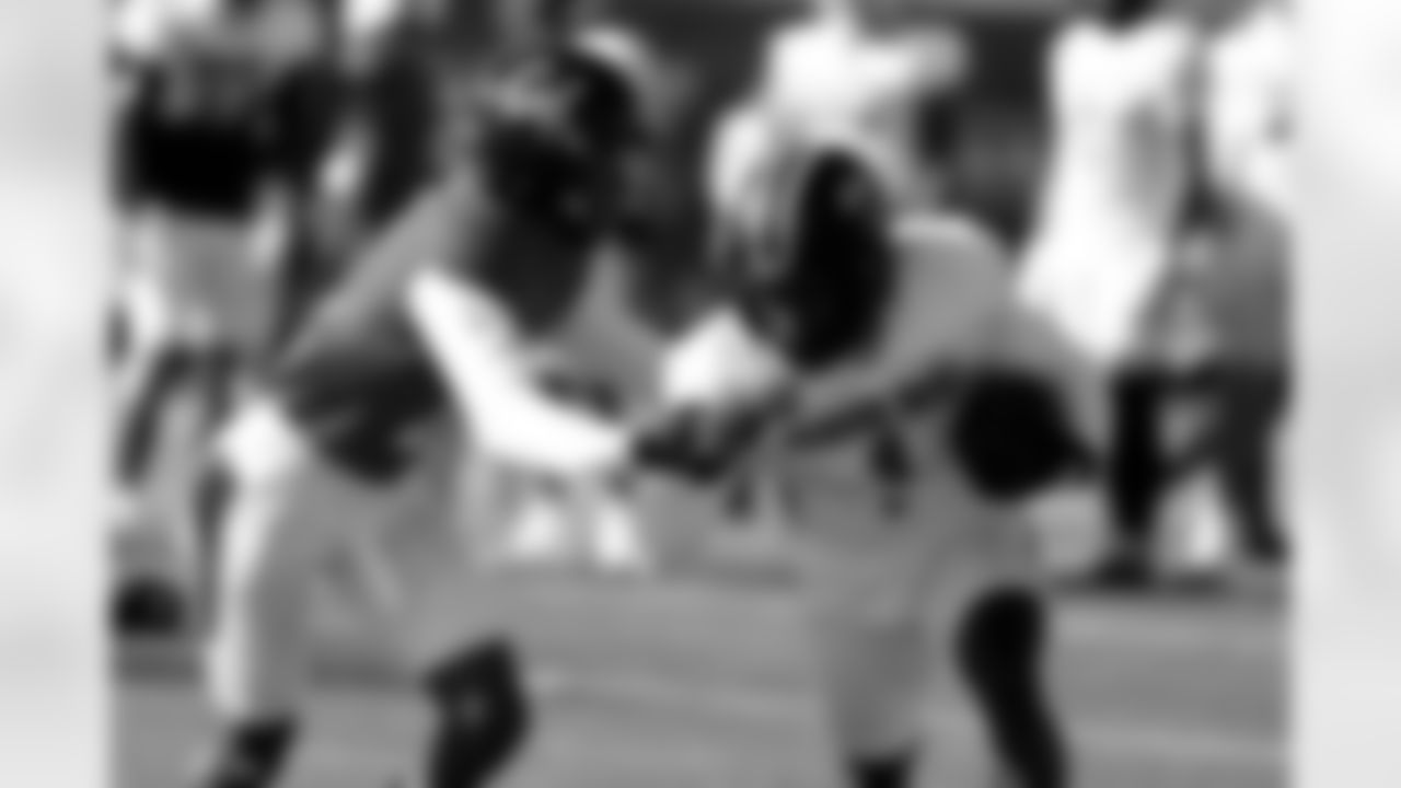 National Team wide receiver Caullin Lacy (1), of Louisville, caries the ball as cornerback Hezekiah Masses, of California, defends during practice for the Senior Bowl NCAA college football game, Wednesday, Jan. 28, 2026, in Mobile, Ala. (AP Photo/Butch Dill)