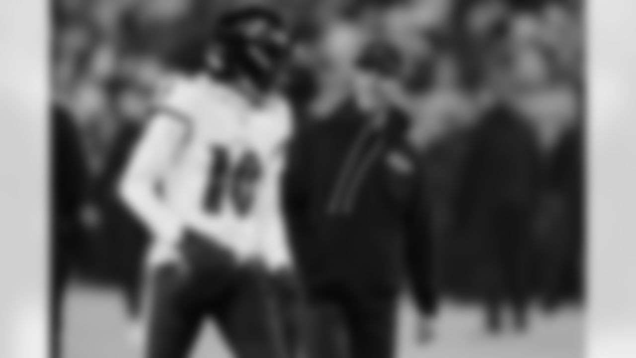 Baltimore Ravens wide receiver Deandre Hopkins (10) talks with head coach John Harbaugh, right, before an NFL football game against the Green Bay Packers, Saturday, Dec. 27, 2025, in Green Bay, Wis. (AP Photo/Matt Ludtke)