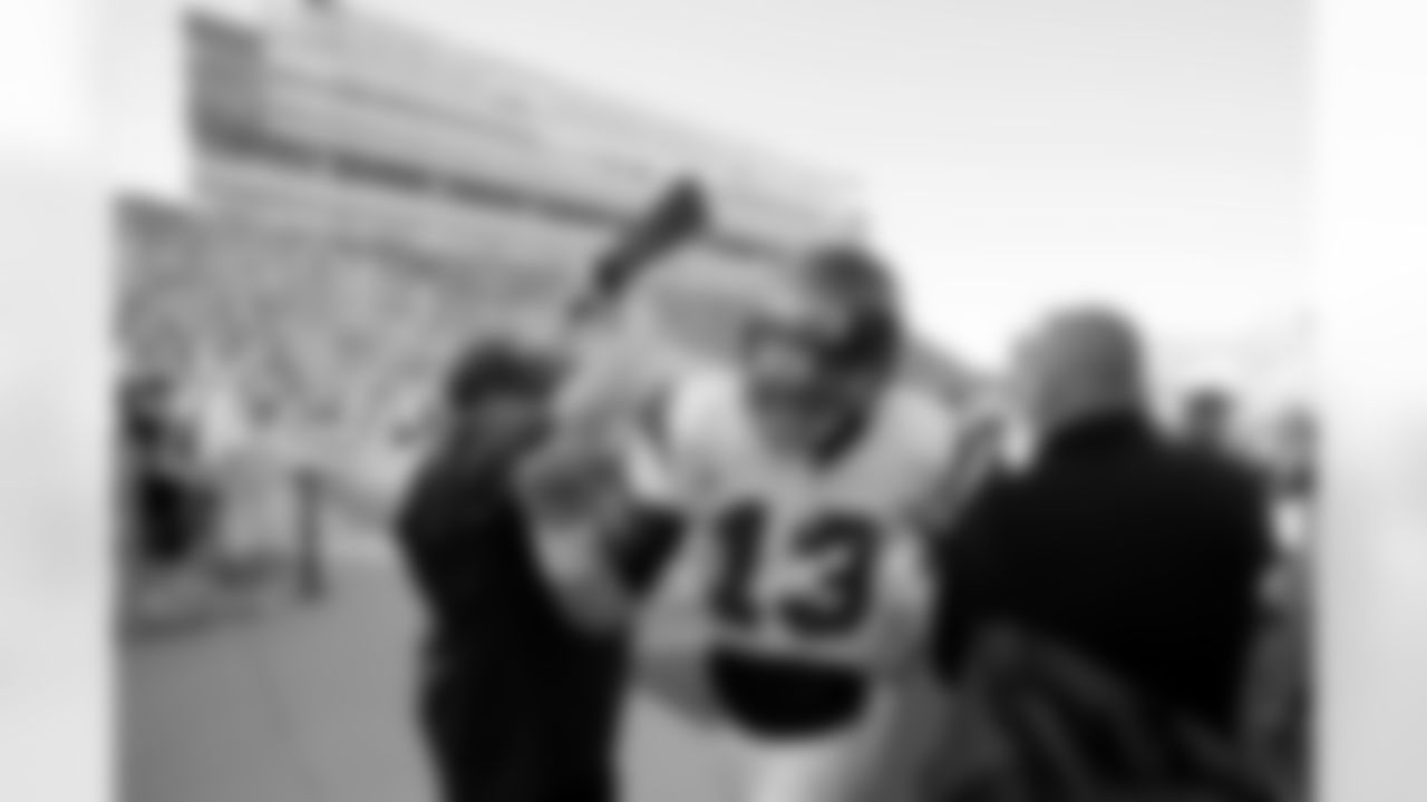 Northwestern quarterback Mike Kafka runs off the field after his team's 17-10 victory over No. 8 Iowa in an NCAA college football game, Saturday, Nov. 7, 2009, in Iowa City, Iowa. (AP Photo/Charlie Neibergall)