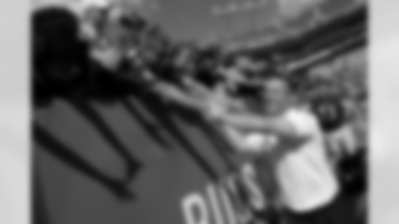 Baltimore Ravens head coach John Harbaugh and guard Marshal Yanda (73) celebrate with fans after an NFL football game against the Tampa Bay Buccaneers in Tampa, Fla., Sunday, Oct. 12, 2014. (AP Photo/Phelan M. Ebenhack)