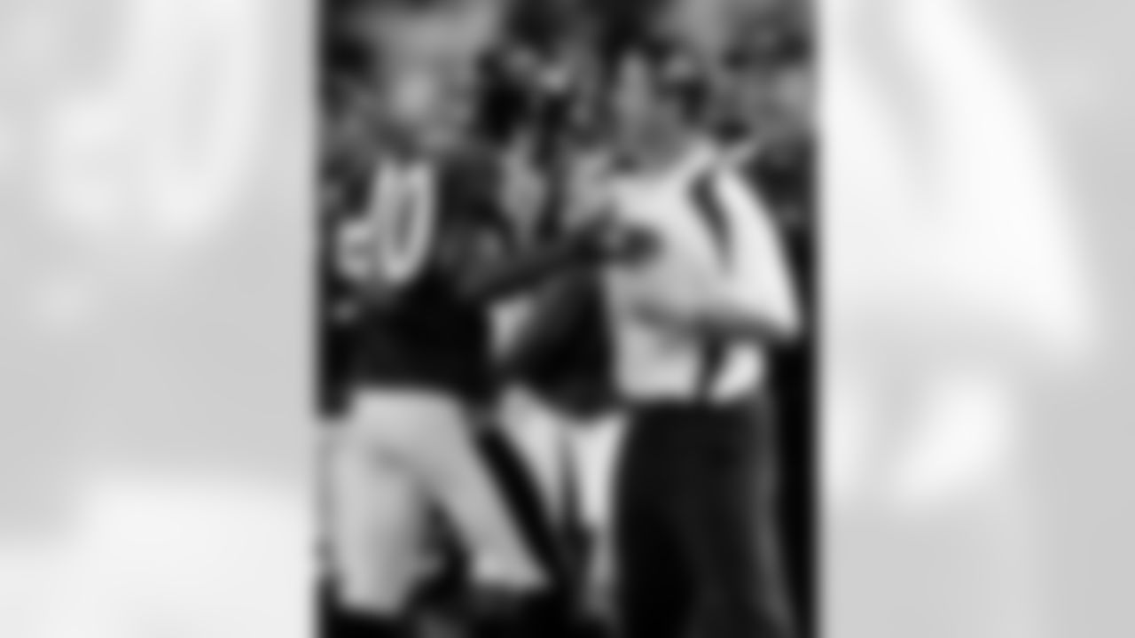 Baltimore Ravens coach John Harbaugh celebrates with safety Ed Reed after defeating the Cleveland Browns 28-10 in a football game, Sunday, Sept. 21, 2008 in Baltimore. (AP Photo/Gail Burton)