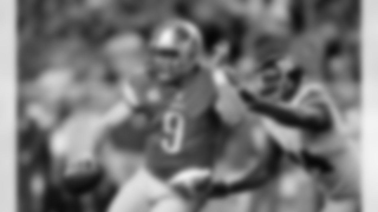 Detroit Lions quarterback Matthew Stafford (9) is chased by New York Giants defensive end Mathias Kiwanuka (94) during the second quarter of an NFL football game, Sunday, Dec. 22, 2013, in Detroit. (AP Photo/Rick Osentoski)