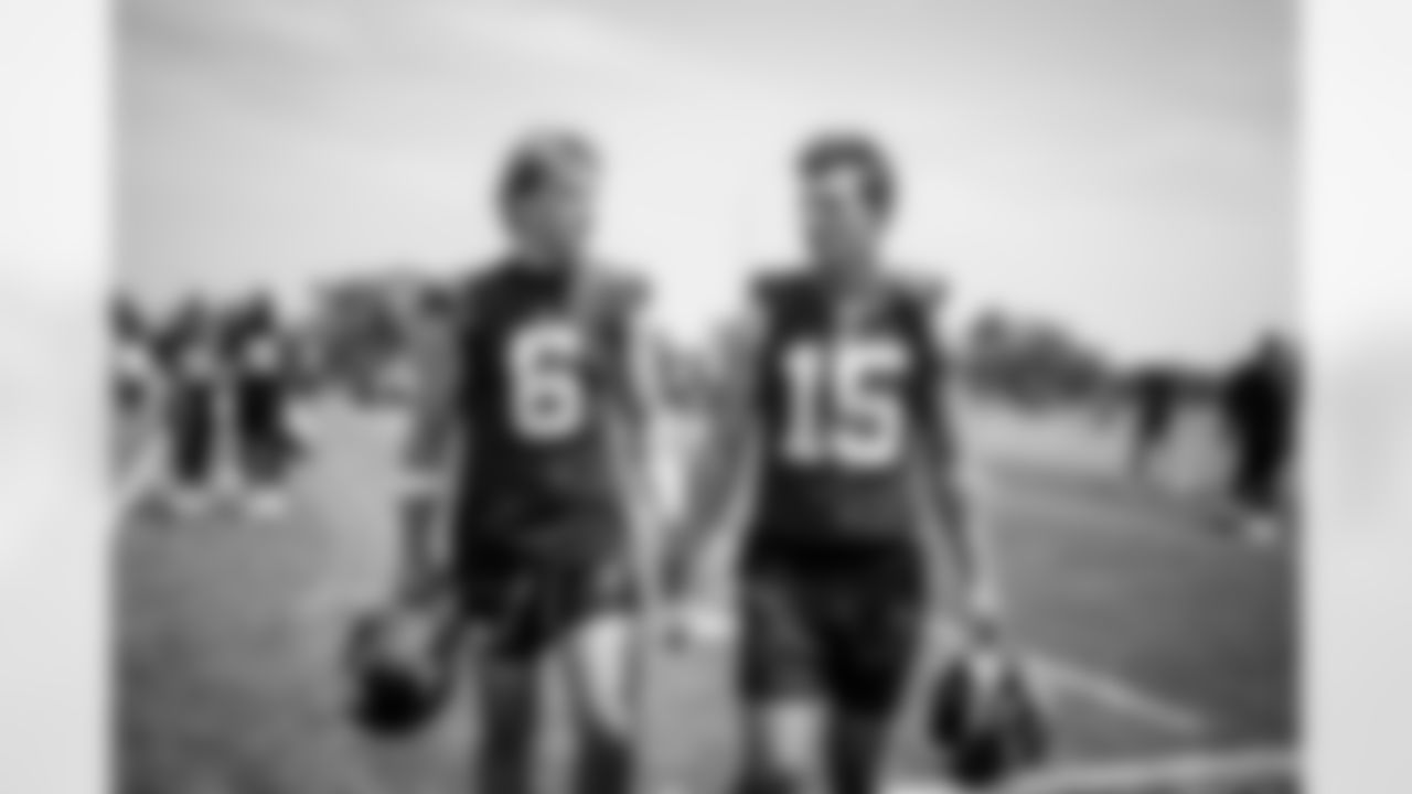 QB Jaxson Dart (6) and QB Tommy DeVito (15)