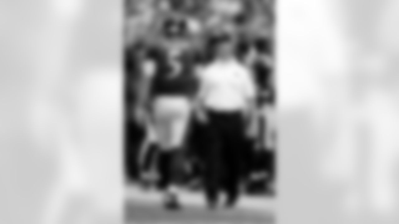 Baltimore Ravens head coach John Harbaugh, right, speaks with Ravens quarterback Joe Flacco in the second half of an NFL football game against the Houston Texans, Sunday, Sept. 22, 2013, in Baltimore. (AP Photo/Nick Wass)