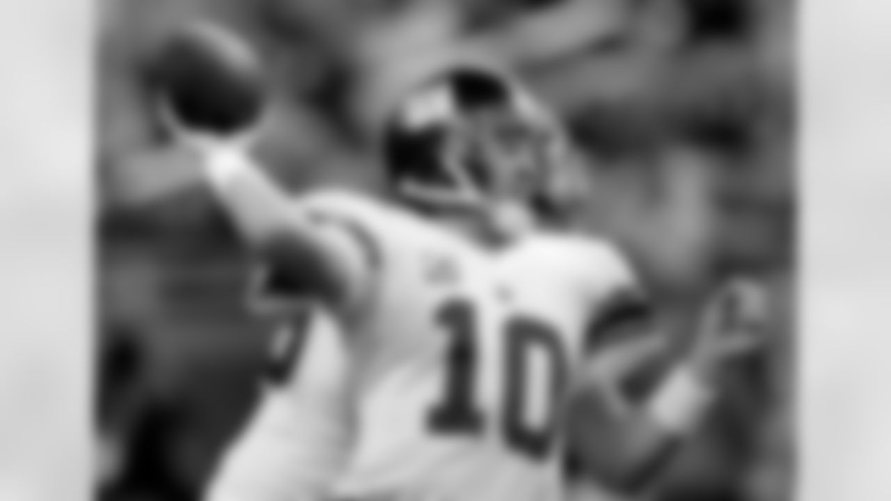 New York Giants quarterback Eli Manning (10) passes during the first quarter of the NFL football game against the Detroit Lions at Ford Field in Detroit, Sunday, Nov. 18, 2007. (AP Photo/Paul Sancya)