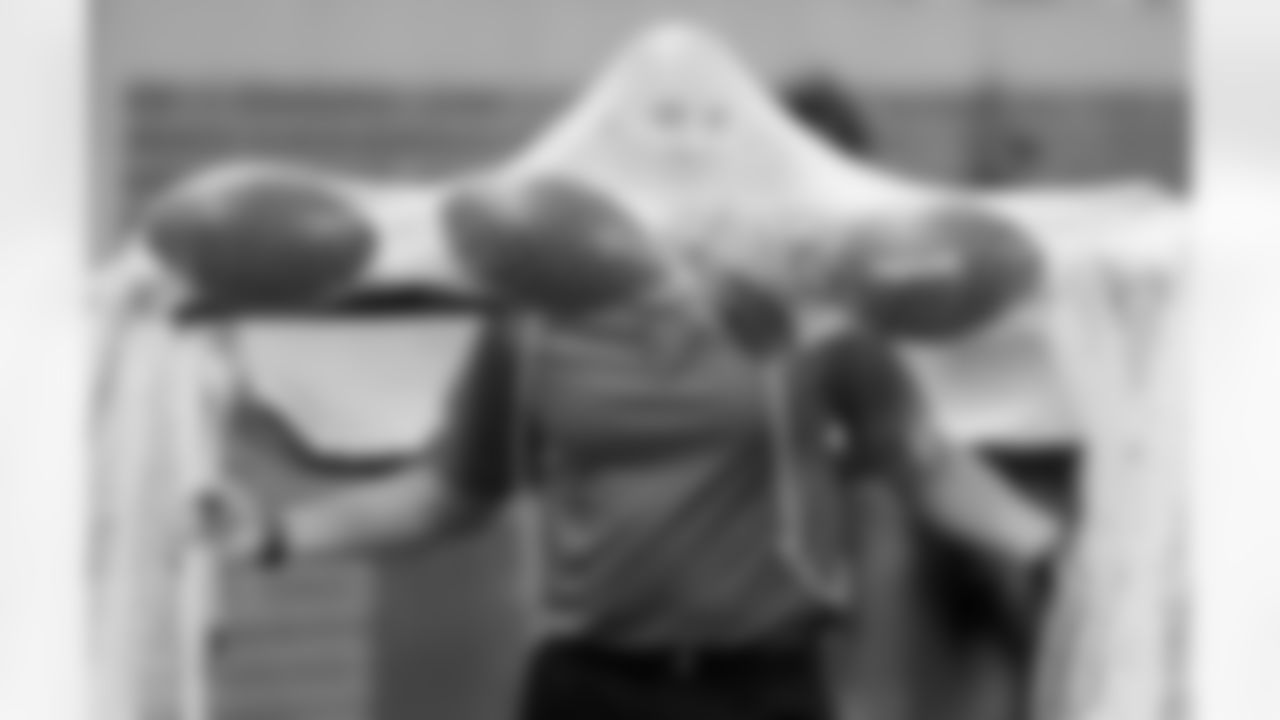 A Detroit Lions team members moves the practice kicking net during the first quarter of an NFL football game against the New York Giants in Detroit, Monday, Sept. 8, 2014. (AP Photo/Paul Sancya)