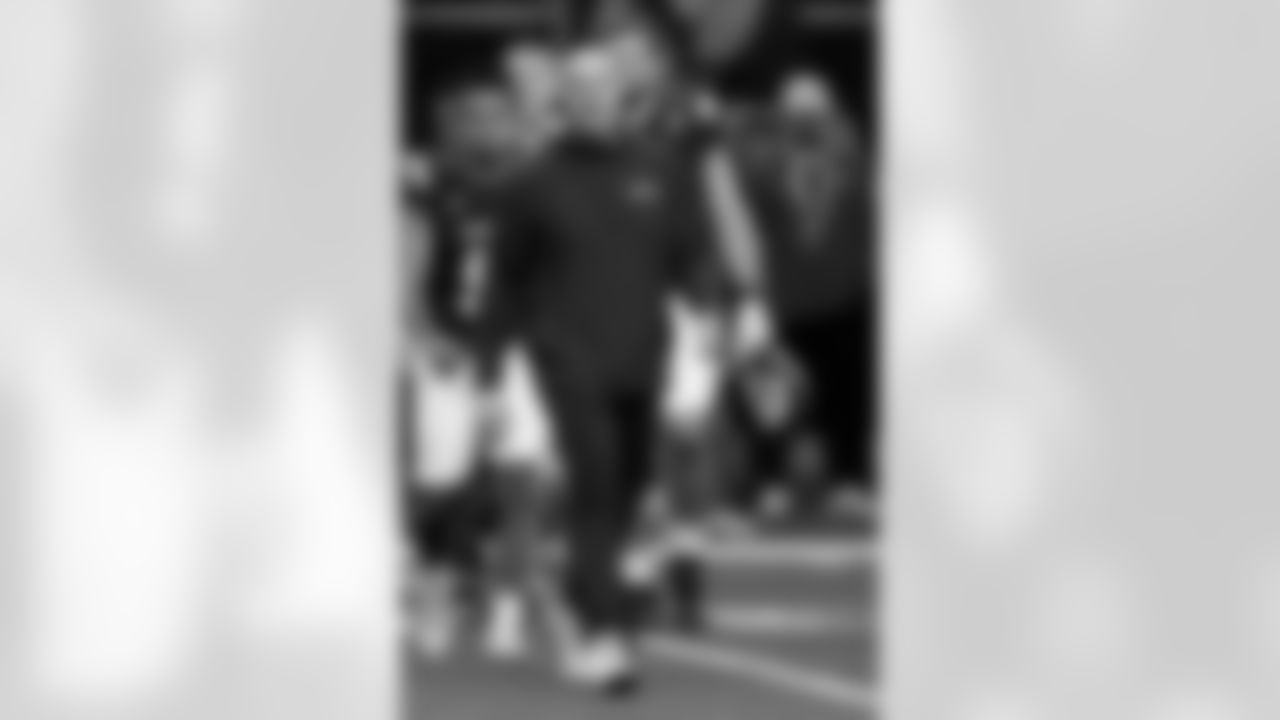 West head coach Mike Kafka, of the New York Giants, walks onto the field following by players at the end of the East West Shrine Bowl NCAA college football game in Frisco, Texas, Thursday, Feb. 1, 2024. (AP Photo/Tony Gutierrez)