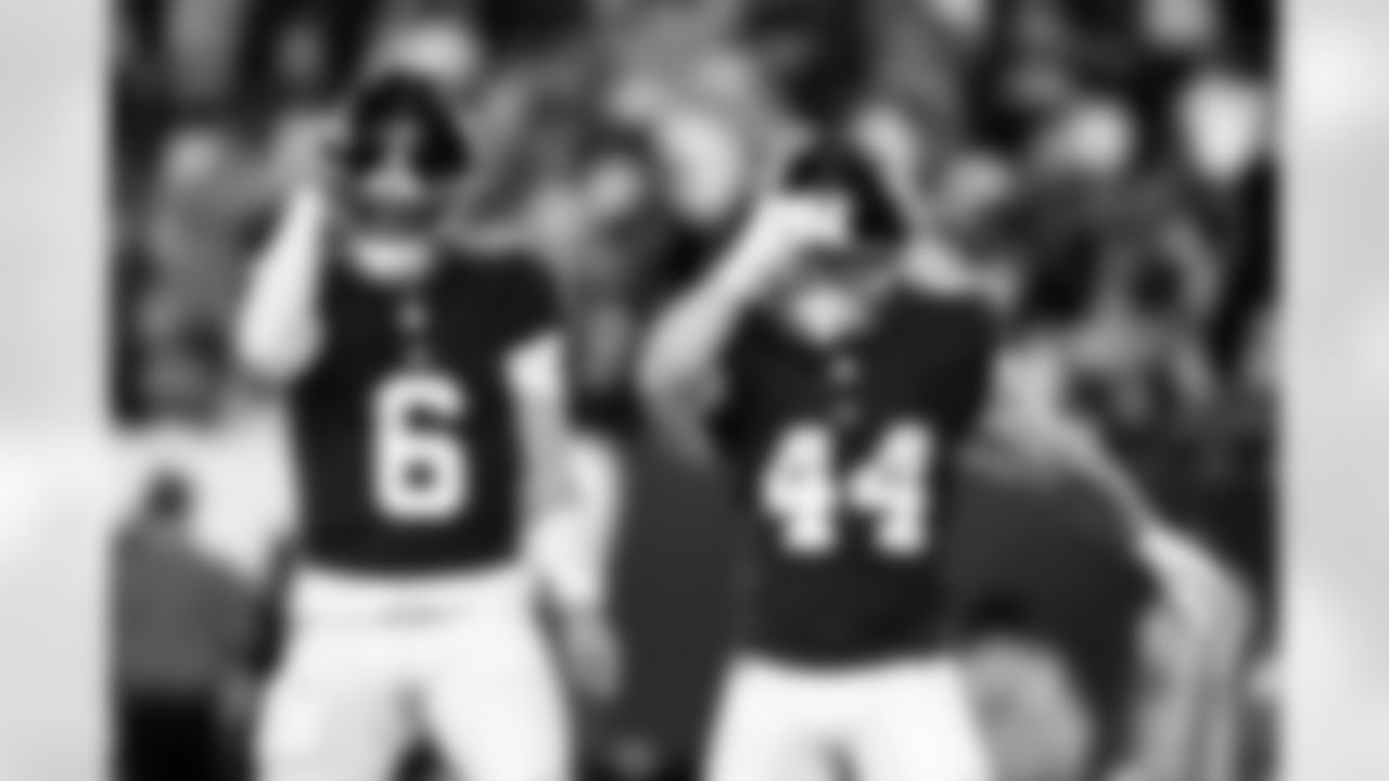 QB Jaxson Dart (6) and RB Cam Skattebo (44)