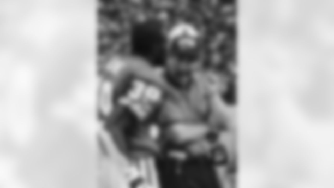 Detroit Lions coach Bobby Ross talks to Lions safety Van Malone during the first quarter against the New York Giants at the Silverdome in Pontiac, Mich. Sunday, Oct. 19, 1997. Malone had intercepted a pass from Giants quarterback Danny Kanell but lost control of the ball after being hit by Giants receiver Chris Calloway. The Giants recovered the ball to set up their first touchdown. (AP Photo/Duane Burleson)