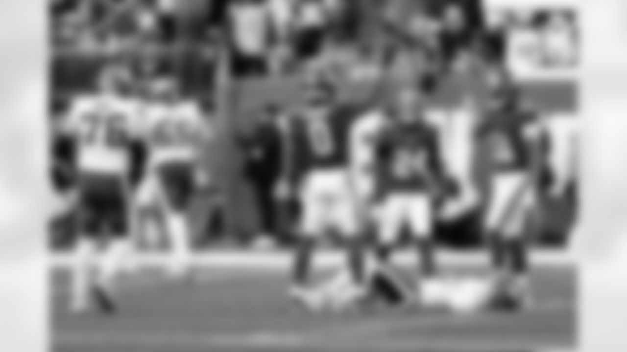 New York Giants linebacker Brian Burns (0) reacts after striping the ball from Minnesota Vikings quarterback J.J. McCarthy, laying on the ground, during an NFL football game Sunday, Dec. 21, 2025, in East Rutherford, N.J. (AP Photo/Adam Hunger)
