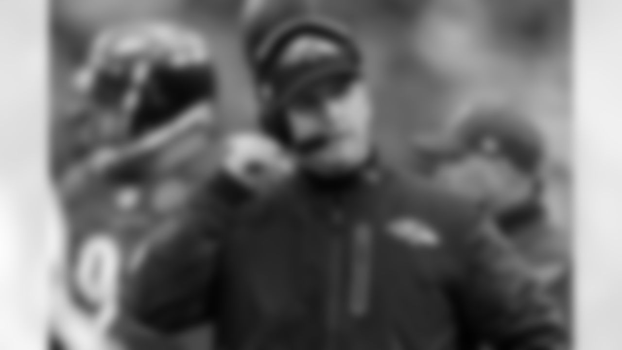 Baltimore Ravens head coach John Harbaugh talks on his headset during the second half of an NFL football game against the Denver Broncos in Baltimore, Sunday, Dec. 16, 2012. (AP Photo/Nick Wass)