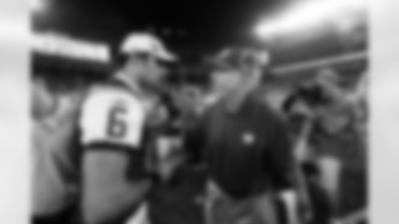 New York Giants head coach Tom Coughlin talks with New York Jets quaterback mark Sanchez (6) after playing against the New York Jets in an preseason NFL football game at the New Meadowlands Stadium in East Rutherford, New Jersey on Monday August 16, 2010 (AP Photo/Evan Pinkus)