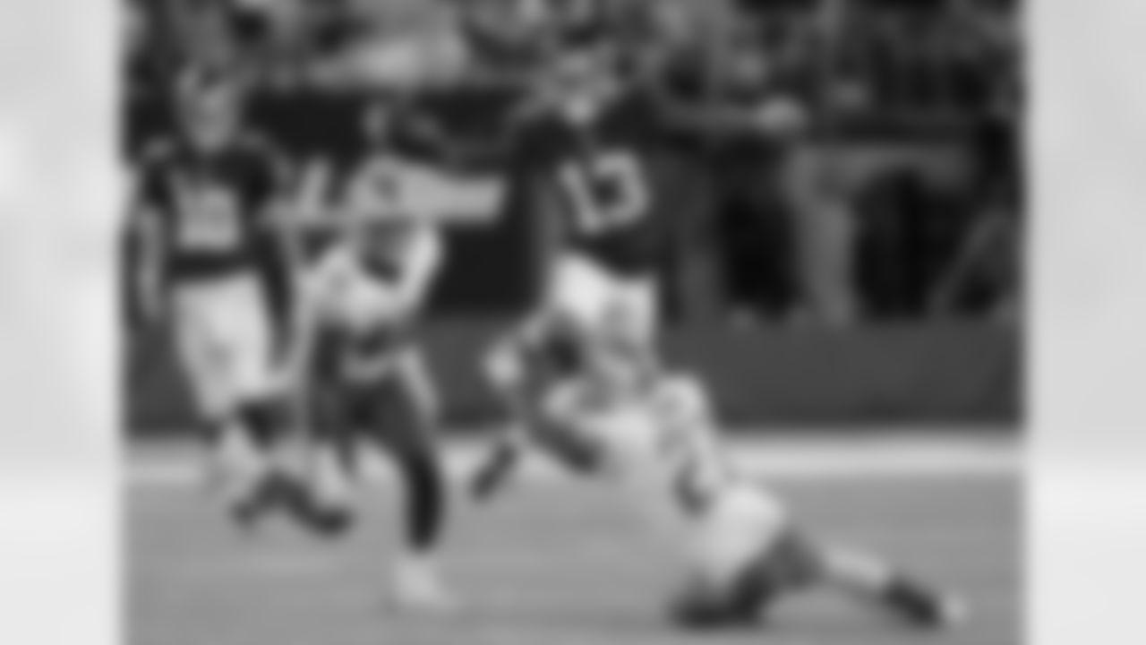 New York Giants wide receiver Odell Beckham (13) leaps over Detroit Lions' Glover Quin (27) as Jarrad Davis (40) watches during the first half of an NFL football game, Monday, Sept. 18, 2017, in East Rutherford, N.J. (AP Photo/Bill Kostroun)