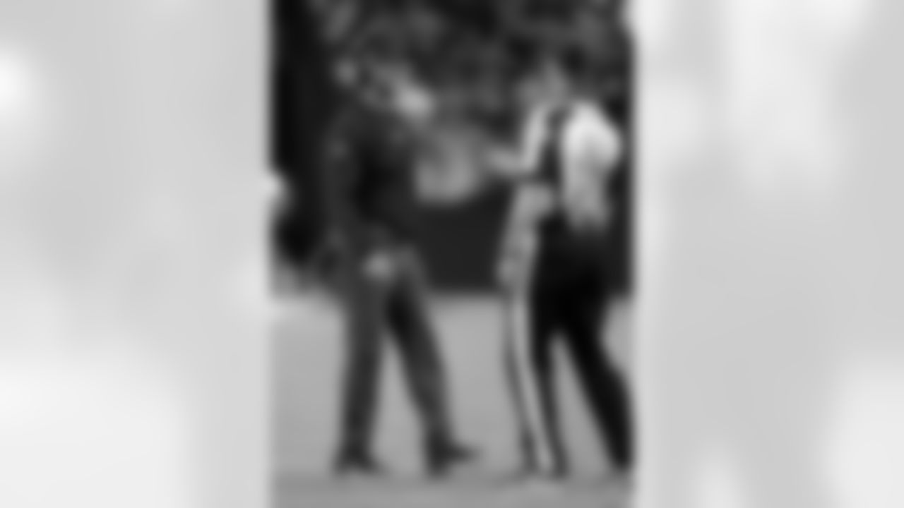 Baltimore Ravens head coach John Harbaugh talks with an official during the second half of an NFL football game against the Las Vegas Raiders, Monday, Sept. 13, 2021, in Las Vegas. (AP Photo/Jeff Bottari)