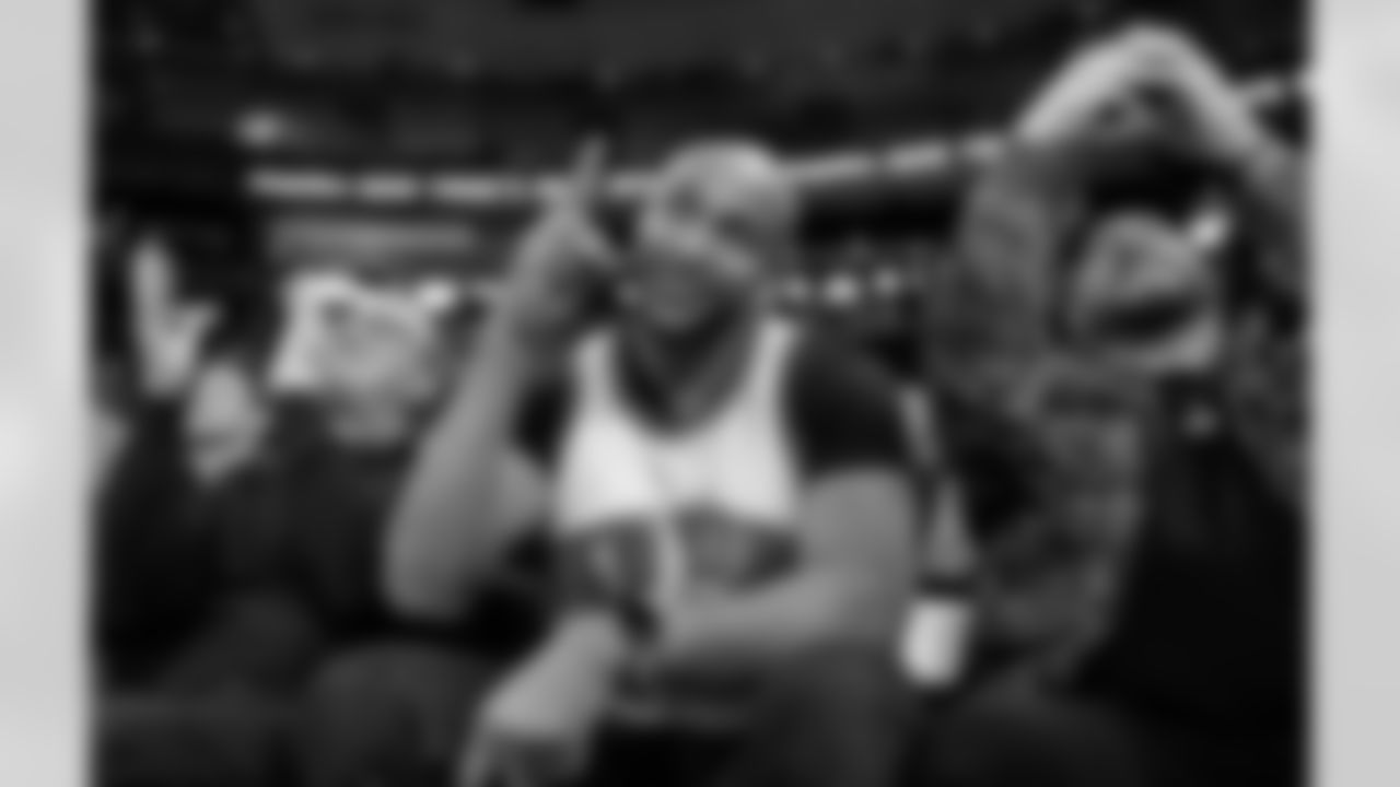 Retired New York Giants wide receiver David Tyree, center, gestures to the crowd as he is introduced during a timeout in the second half of an NBA basketball game between the Brooklyn Nets and the New York Knicks in New York, Sunday, Jan. 26, 2020. Tyree made the famous "helmet catch" in Super Bowl XLII against the New England Patriots. (AP Photo/Kathy Willens)