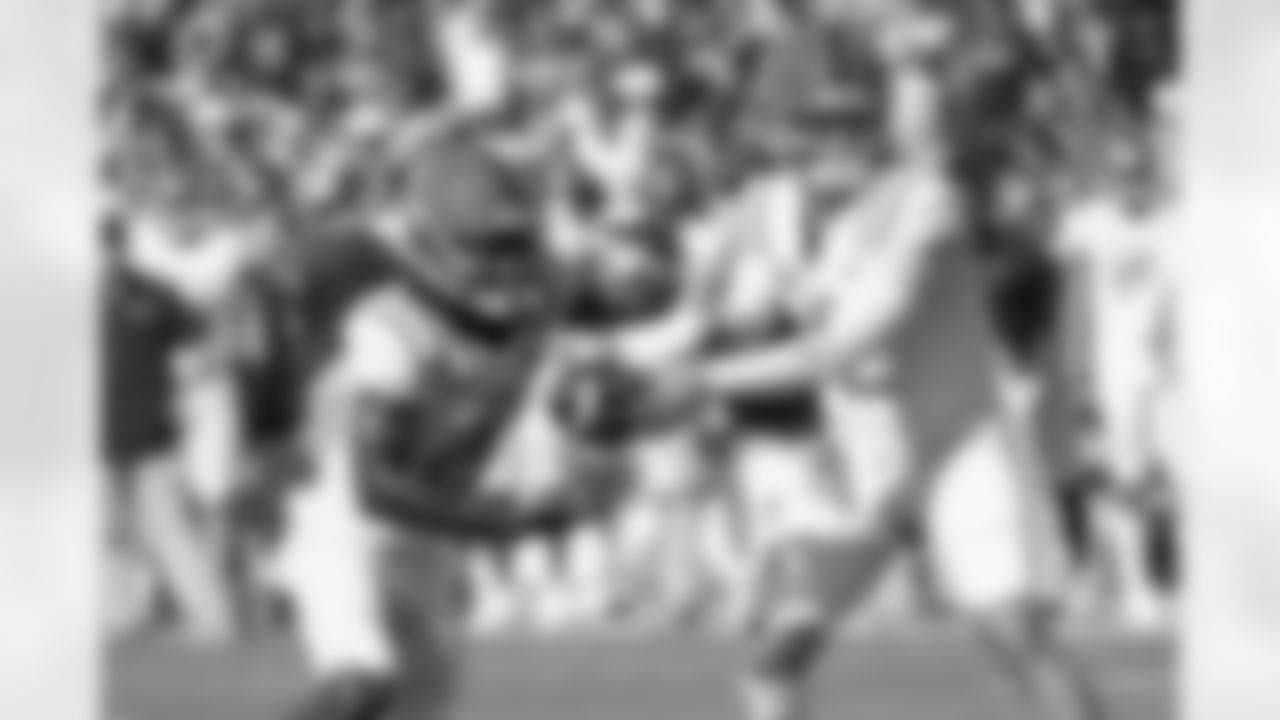 Mississippi quarterback Jaxson Dart (2) hands the ball off to running back Henry Parrish Jr. (21) during the first half of an NCAA college football game against South Carolina Saturday, Oct. 5, 2024, in Columbia, S.C. (AP Photo/Artie Walker Jr.)
