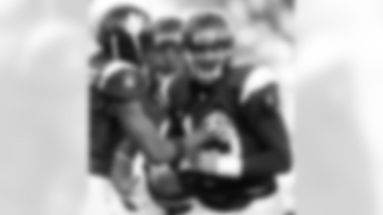 Northwestern quarterback Mike Kafka, right, smiles as he celebrates with Sidney Stewart after scoring a touchdown during the second quarter of an NCAA college football game against Penn State in Evanston, Ill., Saturday, Oct. 31, 2009. (AP Photo/Nam Y. Huh)