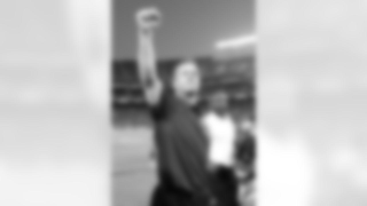 Baltimore Ravens head coach John Harbaugh pumps his fist as he leaves the field after the Ravens beat the San Diego Chargers 16-13 in overtime during an NFL football game Sunday, Nov. 25, 2012 in San Diego.  (AP Photo/Denis Poroy)