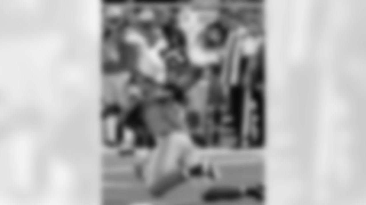 Detroit Lions free safety Louis Delmas (26) tackles New York Giants wide receiver Jerrel Jernigan (12) after Jernigan gained a first down during the first quarter of an NFL football game, Sunday, Dec. 22, 2013, in Detroit. (AP Photo/Duane Burleson)