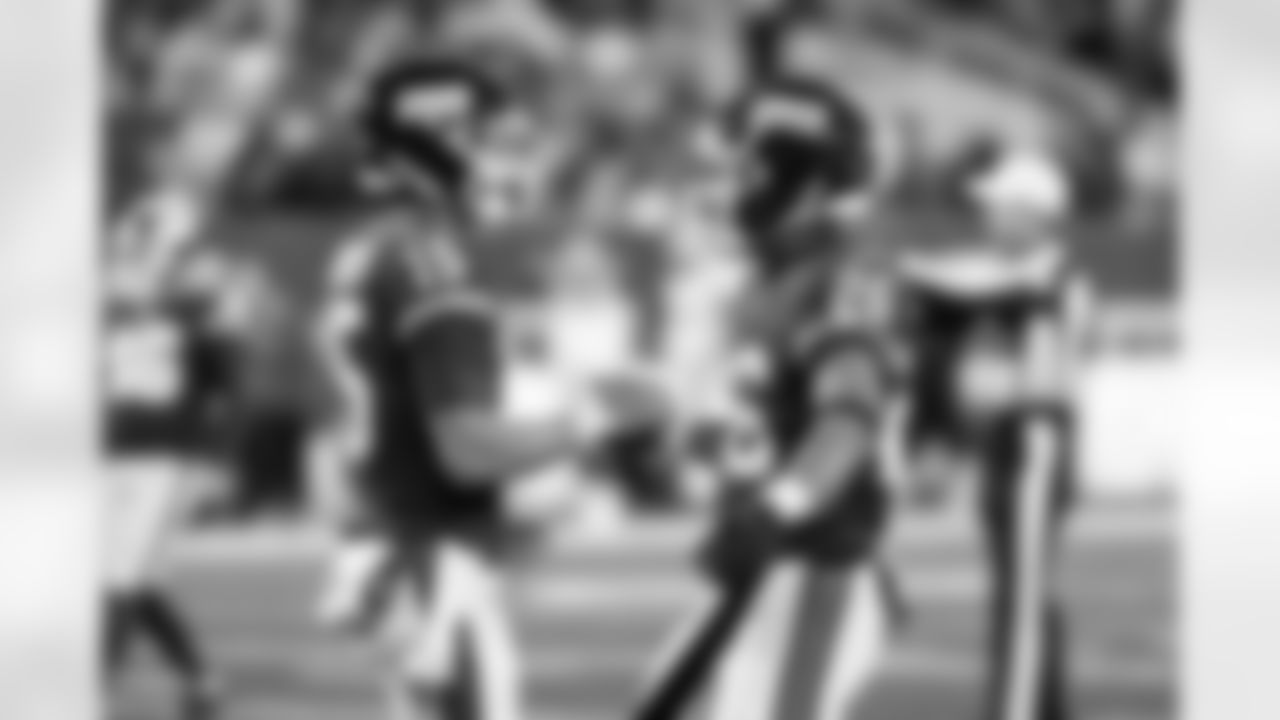 QB Tommy DeVito (15), RB Saquon Barkley (26)