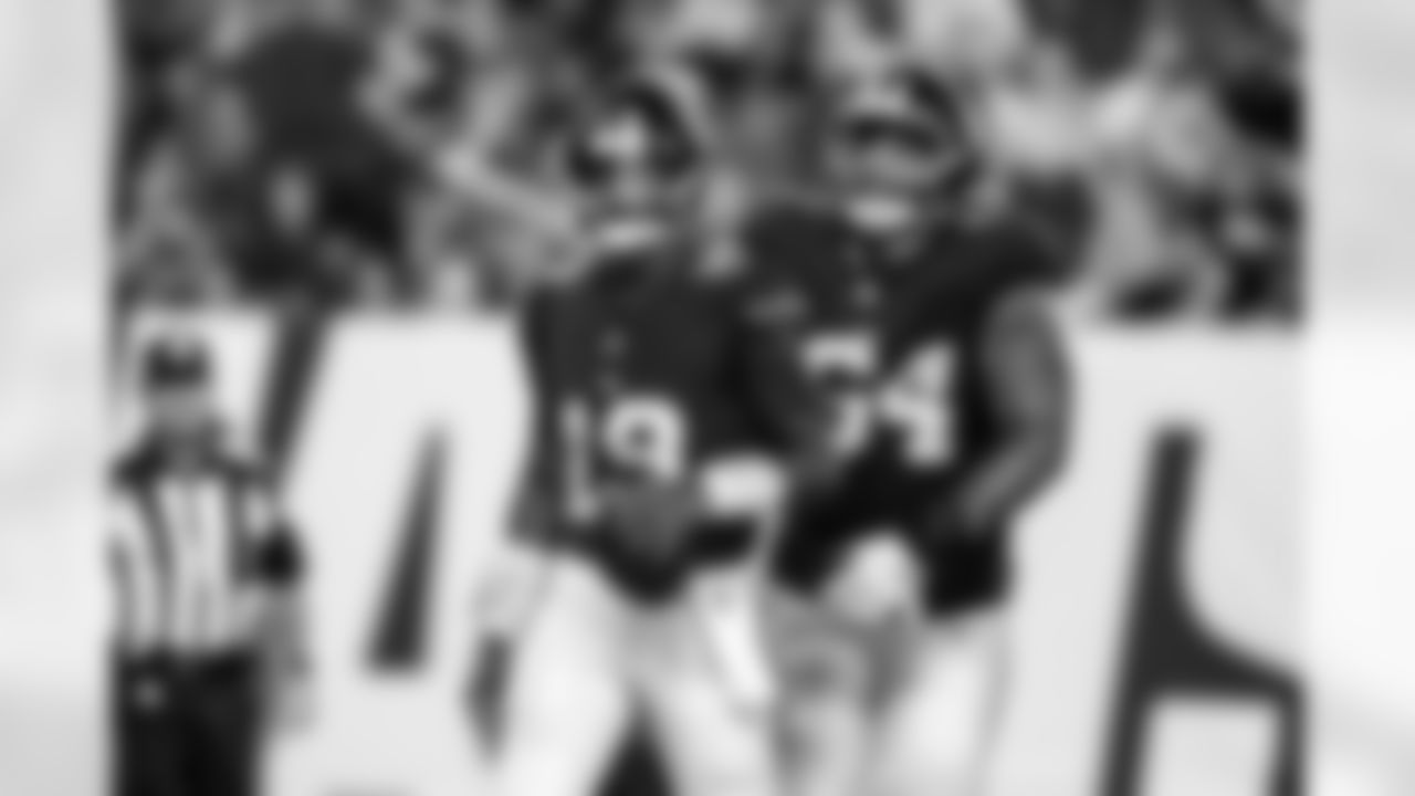 QB Jameis Winston (19) and G Aaron Stinnie (64)