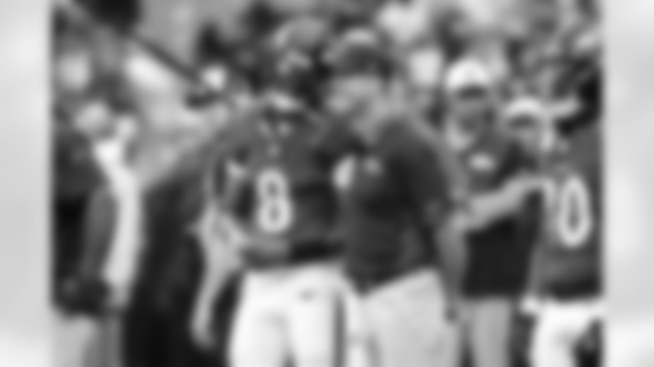 Baltimore Ravens quarterback Lamar Jackson (8) talks with head coach John Harbaugh, right, before an NFL preseason football game against the Indianapolis Colts, Thursday, Aug. 7 2025, in Baltimore. (AP Photo/Terrance Williams)