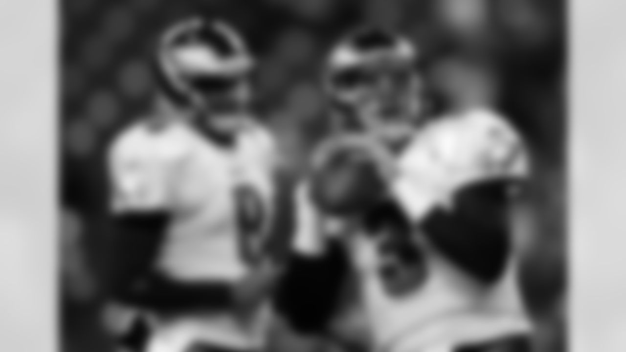 Philadelphia Eagles quarterbacks Vince Young, left, and Mike Kafka, right warm up before the NFL football game against the Seattle Seahawks, Thursday, Dec. 1, 2011, in Seattle. (AP Photo/Ted S. Warren)