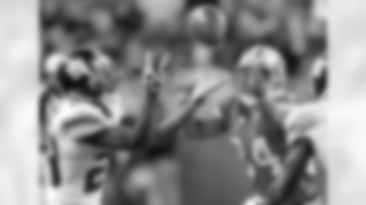 Detroit Lions wide receiver Shaun McDonald, right, and New York Giants cornerback Sam Madison, left, reach out for the loose ball intended for McDonald in the fourth quarter of the football game Sunday, Nov. 18, 2007 in Detroit. Madison intercepted the ball to end the Lions final drive. The Giants beat the Lions 16-10. (AP Photo/Duane Burleson)