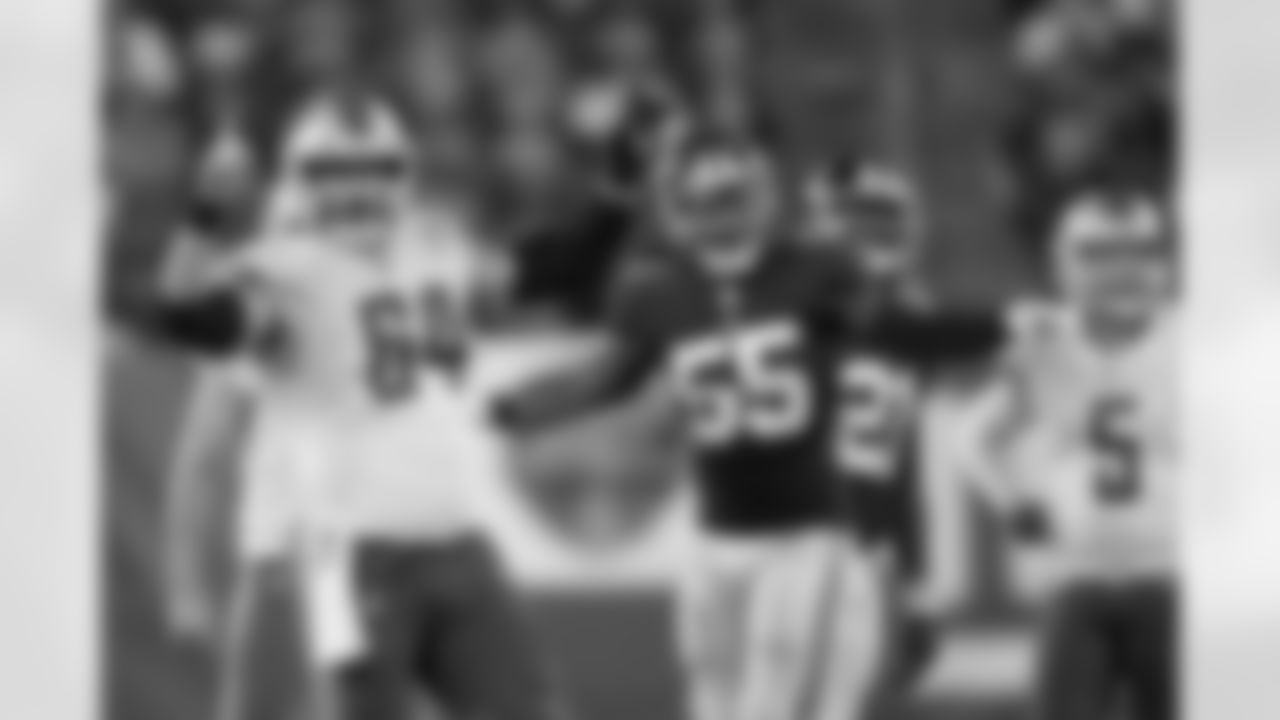 Detroit Lions center Travis Swanson (64) and New York Giants linebacker J.T. Thomas III (55) have differing viewpoints about a Detroit field goal attempt which failed in action Monday Sept. 18, 2017 in East Rutherford, N.J. (Damian Strohmeyer via AP)