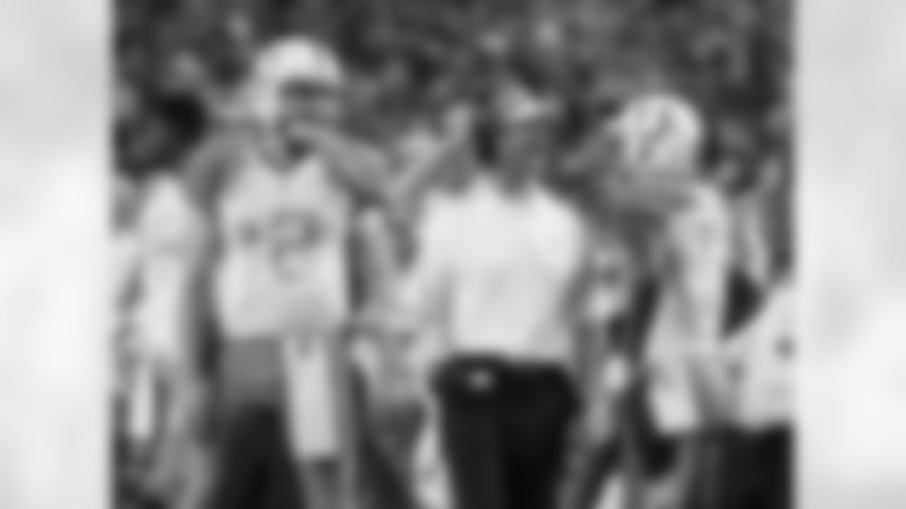 Baltimore Ravens head coach John Harbaugh talks to Indianapolis Colts' T .Y. Hilton (right) and Indianapolis Colts' Andrew Luck (12) during the first half of the NFL Football Pro Bowl Sunday, Jan. 25, 2015, in Glendale, Ariz. (AP Photo/Mark Humphrey)