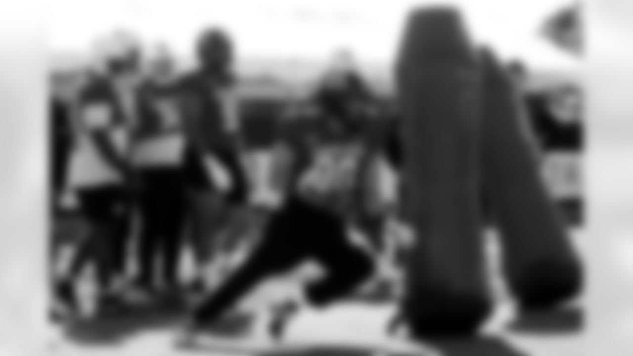 National Team defensive end Max Llewellyn (90), of Iowa, runs through drills during practice for the Senior Bowl NCAA college football game Tuesday, Jan. 27, 2026, in Mobile, Ala. (AP Photo/Butch Dill)