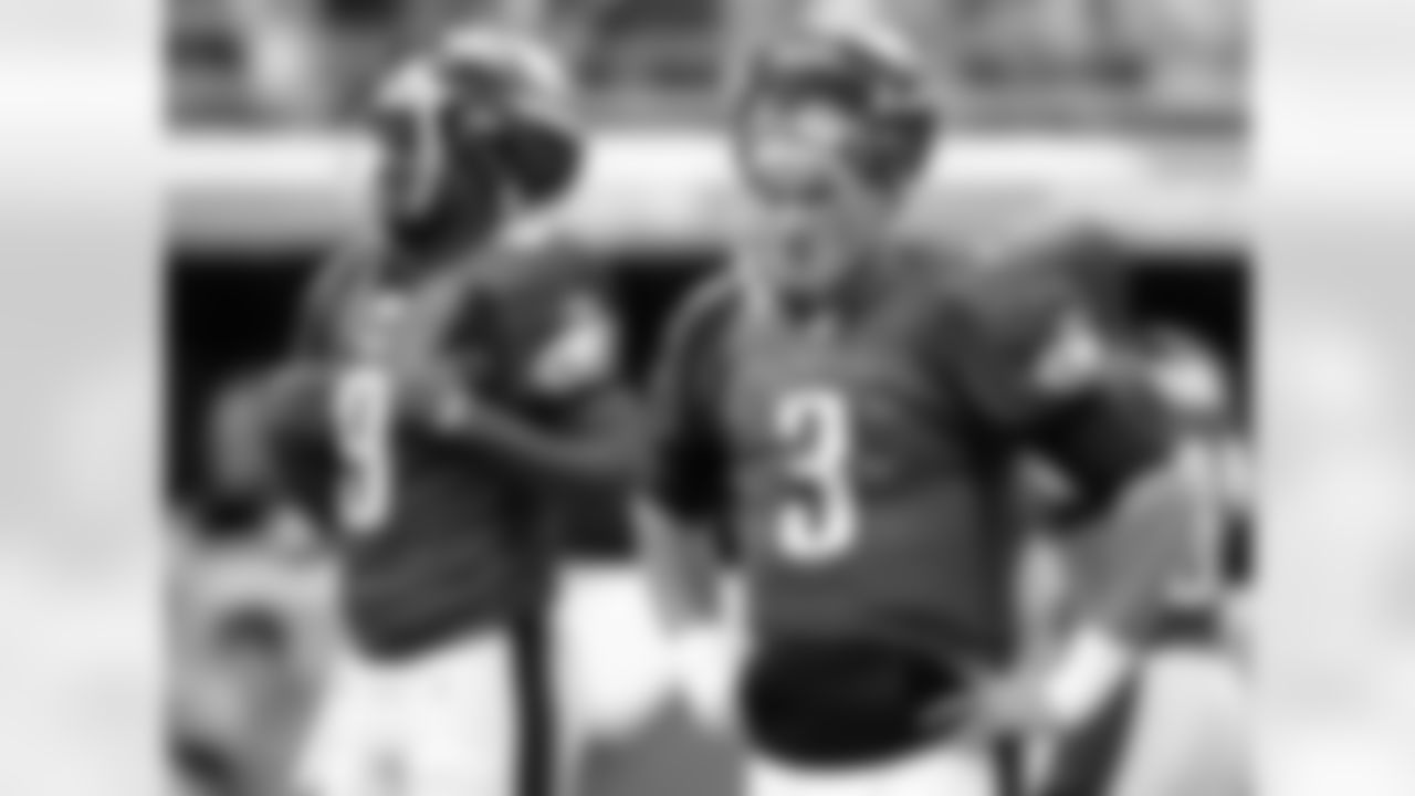 Philadelphia Eagles quarterbacks Mike Kafka (3) and Vince Young (9) are seen during practice before the start of an NFL football game Sunday, Dec. 11, 2011, in Miami . (AP Photo/Lynne Sladky)