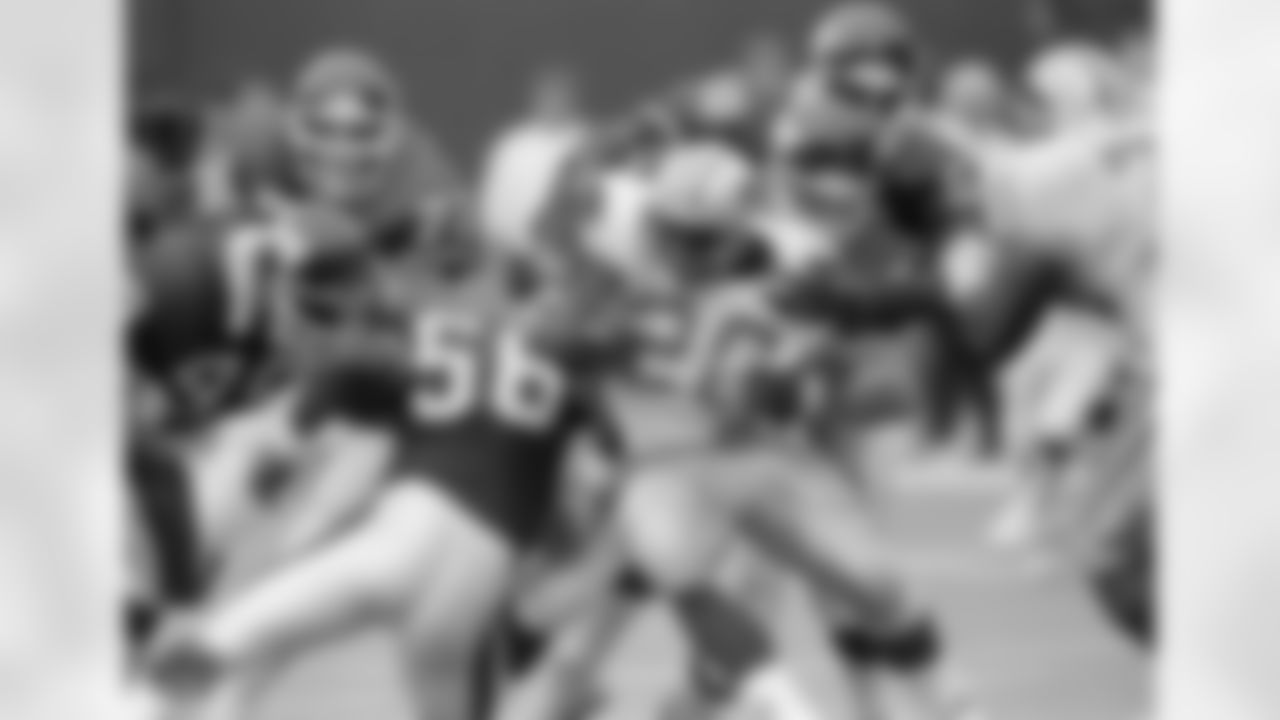 Detroit Lions Barry Sanders, carried for three yards before being brought down by Giants Erik Howard and Carl Banks, rear, in the second quarter at Giants Stadium, East Rutherford, N.J., Sept. 18, 1989. The Giants won 24-14. (AP Photo/Bill Kostroun)