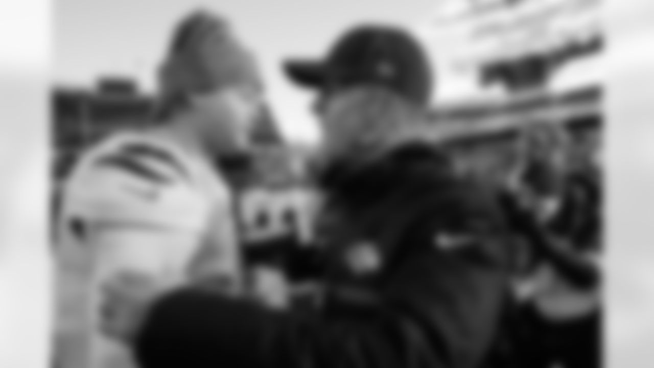 Cincinnati Bengals quarterback Joe Burrow, left, greets Baltimore Ravens head coach John Harbaugh, right, after an NFL football game, Sunday, Dec. 14, 2025, in Cincinnati. (AP Photo/Carolyn Kaster)