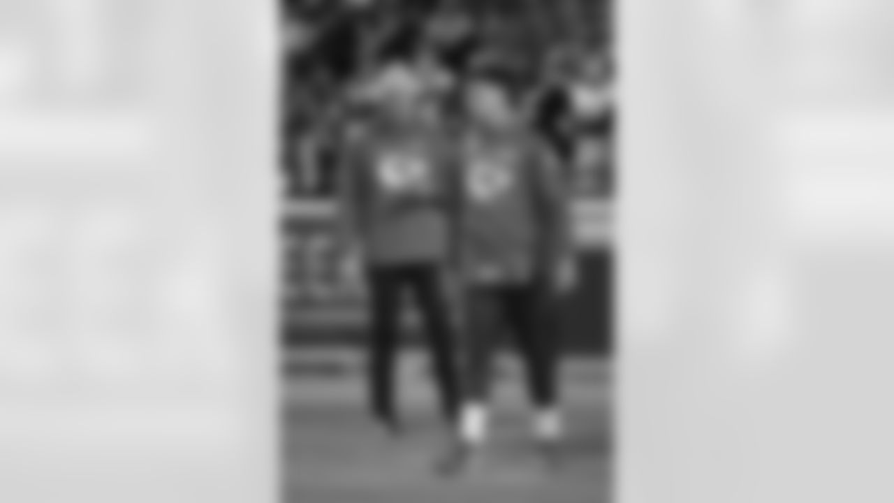 Kansas City Chiefs quarterbacks coach Mike Kafka, left, watches Patrick Mahomes during pre-game warmups before an NFL wild-card playoff football game against the Pittsburgh Steelers, Sunday, Jan. 16, 2022 in Kansas City, Mo. (AP Photos/Reed Hoffmann)
