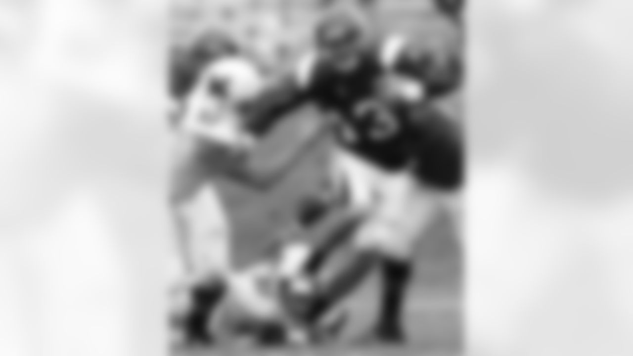 Northwestern quarterback Mike Kafka (13) runs past Miam i(Ohio)'s Matt Kajmowicz (97) during the fourth quarter of an NCAA college football game in Evanston, Ill., Saturday, Oct. 10, 2009. Northwestern won 16-6.(AP Photo/Nam Y. Huh)