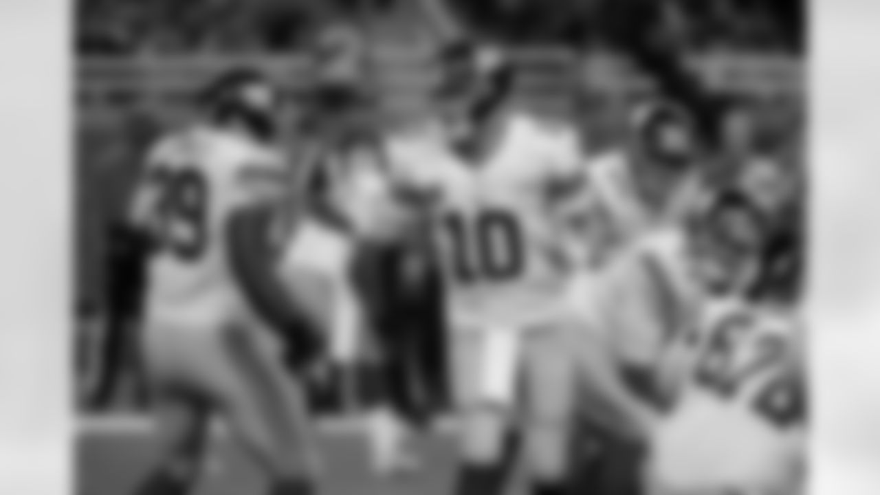 New York Giants quarterback Eli Manning (10) shouts instructions from the line to fullback John Conner (39) during the first quarter of an NFL football game against the Detroit Lions in Detroit, Sunday, Dec. 22, 2013. (AP Photo/Duane Burleson)