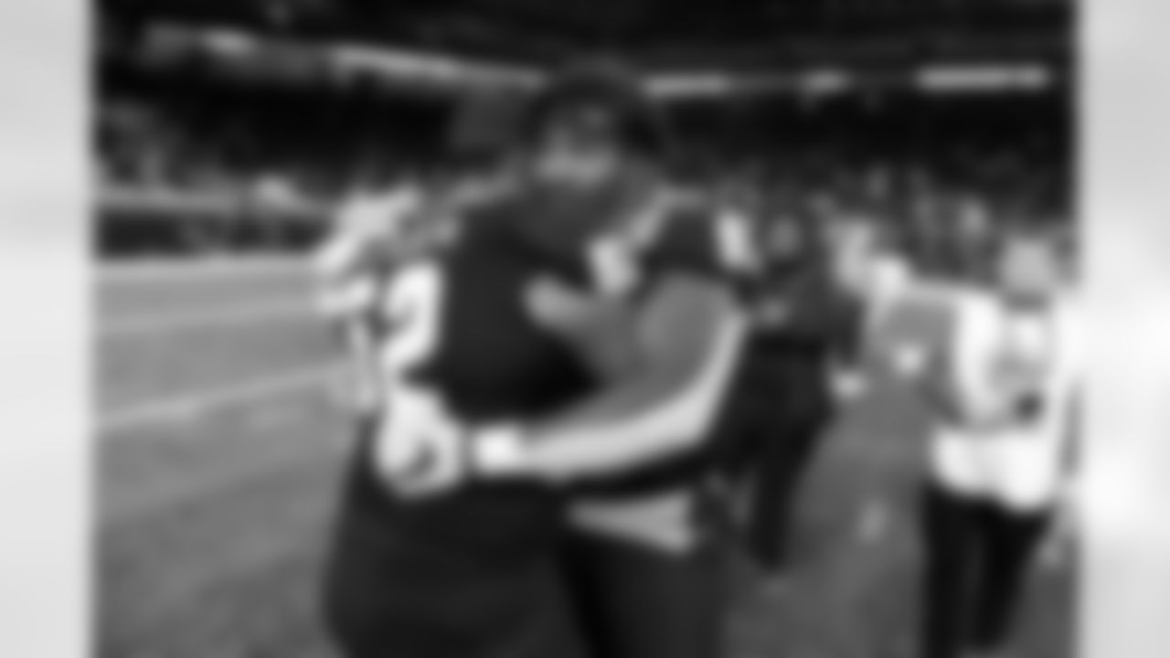 Toledo defensive tackles Cavon Butler, left, and Darius Alexander, front right, hug after the GameAbove Sports Bowl NCAA college football game against Pittsburgh, Thursday, Dec. 26, 2024, in Detroit. (AP Photo/Jose Juarez)