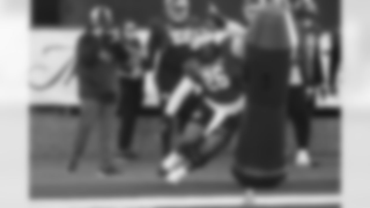 American Team defensive tackle Rayshaun Benny (26), of Michigan, runs through drills during practice for the Senior Bowl NCAA college football game Tuesday, Jan. 27, 2026, in Mobile, Ala. (AP Photo/Butch Dill)