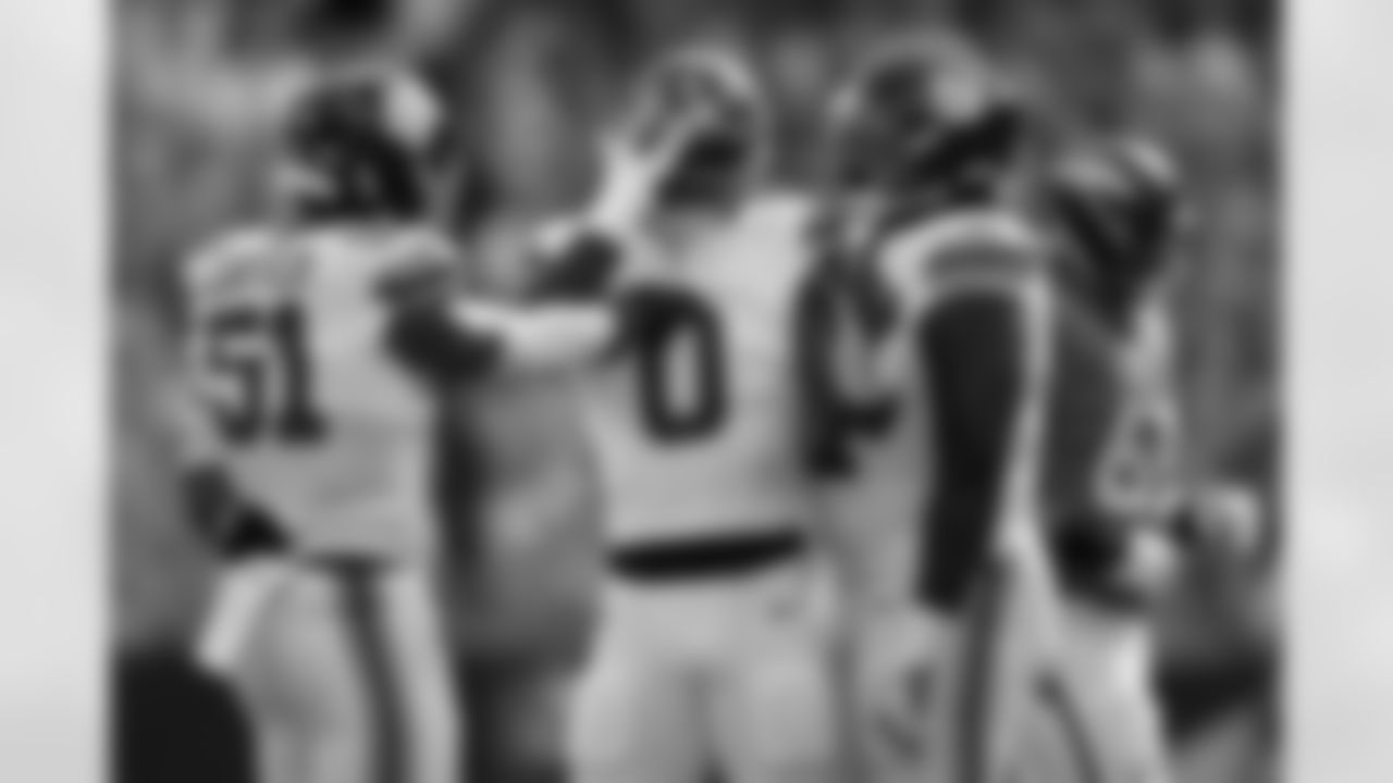New York Giants linebacker Brian Burns (0) is congratulated by teammates after sacking Denver Broncos quarterback Bo Nix during the first half of an NFL football game in Denver, Sunday, Oct. 19, 2025. (AP Photo/Jack Dempsey)