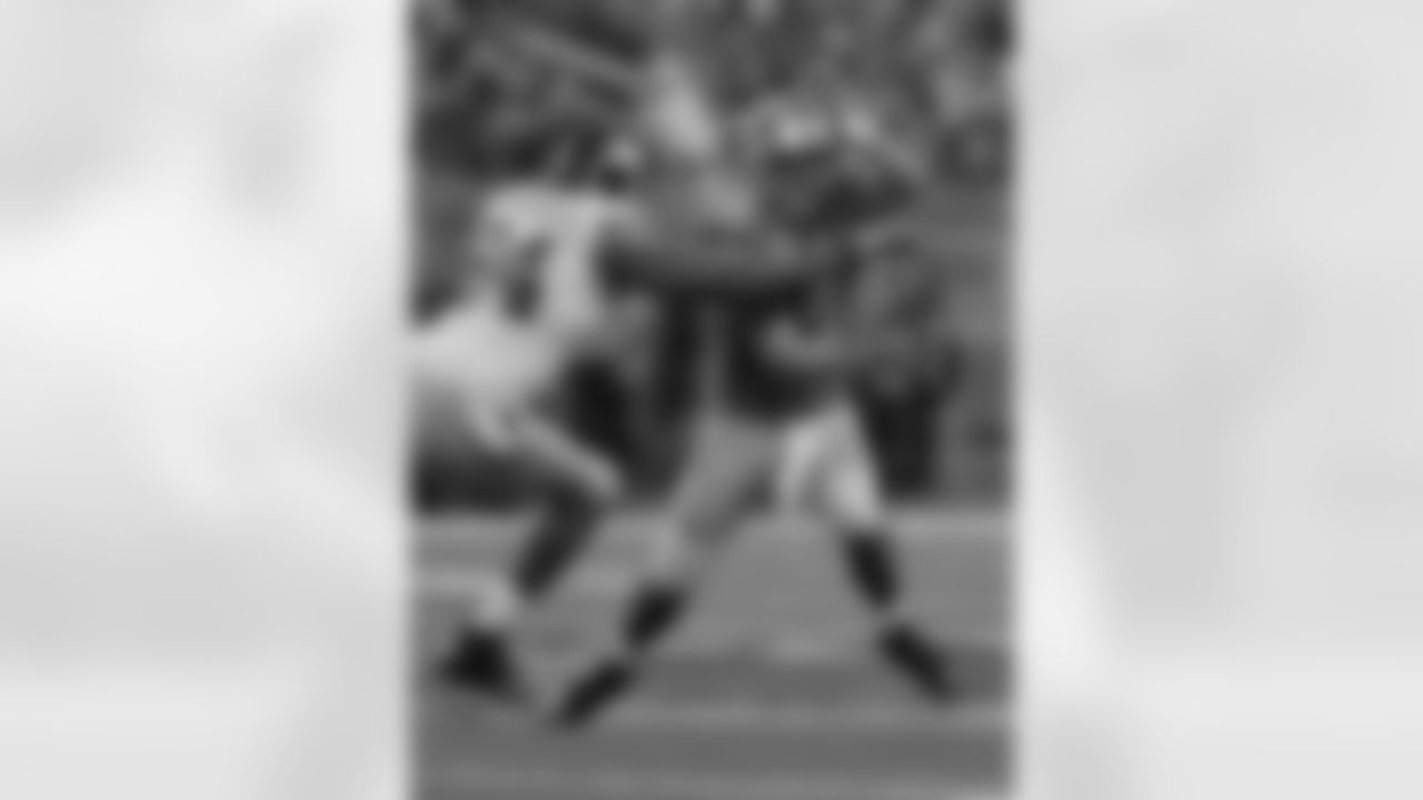 Detroit Lions quarterback Matthew Stafford (9) gets sacked by New York Giants defensive end Mathias Kiwanuka (94) during a week 16 football game on December 22, 2013 in Detroit, Michigan (AP Photo/Evan Pinkus)