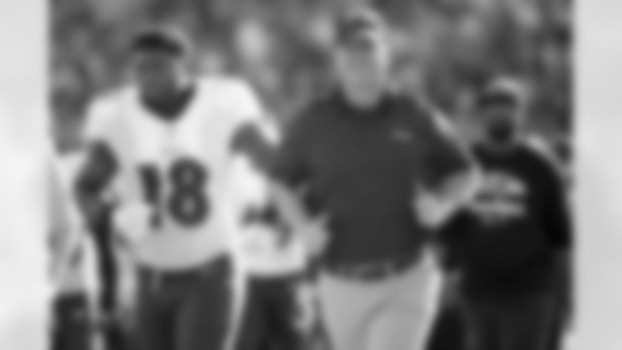 Baltimore Ravens head coach John Harbaugh, right, and linebacker Roquan Smith (18) leave the field after the end of the first half of an NFL football game against the Jacksonville Jaguars, Sunday, Nov. 27, 2022, in Jacksonville, Fla. (AP Photo/Phelan M. Ebenhack)