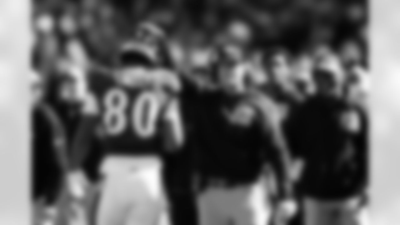 Baltimore Ravens head coach John Harbaugh pats tight end Isaiah Likely's helmet during the first half of an NFL football game against the Detroit Lions, Sunday, Oct. 22, 2023, in Baltimore. (AP Photo/Nick Wass)